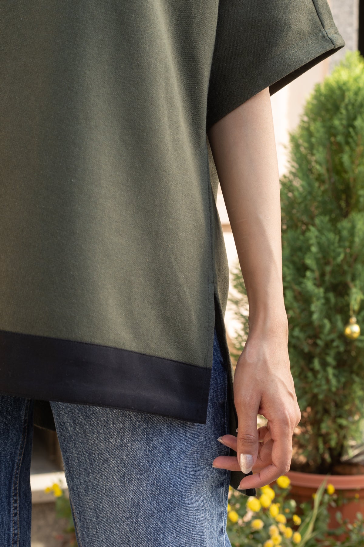 Erica Olive boat neck high-low hem top for winter